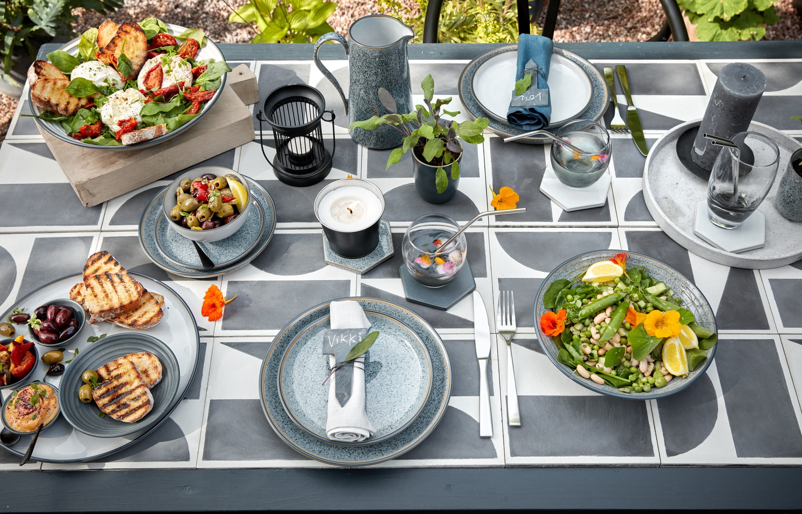 https://www.denbypottery.com/file/v8748853852833615191/general/Outdoor%20dining%20table%20featuring%20Denby%20Studio%20Grey.jpg